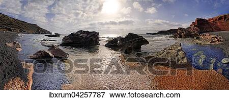 Stock Photo - Strand Charco de los Clicos, teilweise im Meer versunkener Krater des Vulkans Montana de Golfo, El Golfo, Lanzarote, Kanarische Inseln, Spanien, Europa. Fotosearch