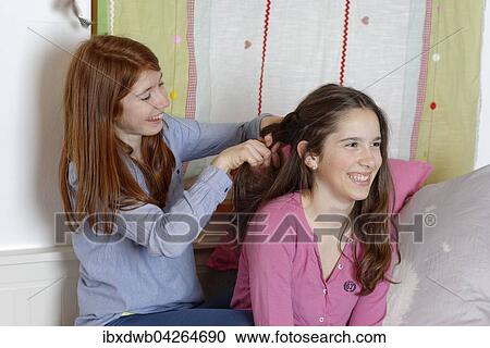 Teenager, Madchen, Freundinnen, frisieren sich, Flechtfrisur, flechten sich Haare, Deutschland, Europa View Large Photo Image Stock Image - Teenager, Madchen, Freundinnen, frisieren sich, Flechtfrisur, flechten sich Haare, Deutschland, Europa. Fotosearch