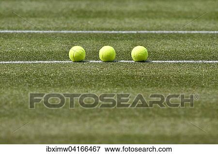 Stock Photo - Tennisballe auf Rasen, Stuttgart, Baden-Wurttemberg, Deutschland, Europa. Fotosearch