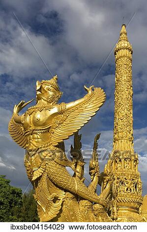 Thung Si Muang Park, Mueang, Garuda-Figur vor der Goldenen Riesen-Kerze, Kerzen-Monument, Ubon Ratchathani, Isan, Isaan, Thailand, Asien View Large Photo Image Stock Photo - Thung Si Muang Park, Mueang, Garuda-Figur vor der Goldenen Riesen-Kerze, Kerzen-Monument, Ubon Ratchathani, Isan, Isaan, Thailand, Asien. Fotosearch