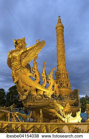 Thung Si Muang Park, Mueang, Garuda-Figur vor der Goldenen Riesen-Kerze, Kerzen-Monument, Ubon Ratchathani, Isan, Isaan, Thailand, Asien View Large Photo Image Stock Photo - Thung Si Muang Park, Mueang, Garuda-Figur vor der Goldenen Riesen-Kerze, Kerzen-Monument, Ubon Ratchathani, Isan, Isaan, Thailand, Asien. Fotosearch