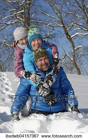 Vater und seine Kindern toben im Schnee, Bad Heilbrunn, Oberbayern, Bayern, Deutschland, Europa View Large Photo Image Stock Photo - Vater und seine Kindern toben im Schnee, Bad Heilbrunn, Oberbayern, Bayern, Deutschland, Europa. Fotosearch