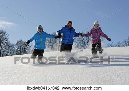 Vater und zwei Kinder laufen im tiefen Schnee, Bad Heilbrunn, Oberbayern, Bayern, Deutschland, Europa View Large Photo Image Stock Image - Vater und zwei Kinder laufen im tiefen Schnee, Bad Heilbrunn, Oberbayern, Bayern, Deutschland, Europa. Fotosearch