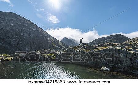 Wanderer an einem Bergsee, Rauhenbergsee im Klafferkessel, Seenplatte, Rohrmoos-Untertal, Schladminger Tauern, Steiermark, Osterreich, Europa View Large Photo Image Stock Image - Wanderer an einem Bergsee, Rauhenbergsee im Klafferkessel, Seenplatte, Rohrmoos-Untertal, Schladminger Tauern, Steiermark, Osterreich, Europa. Fotosearch