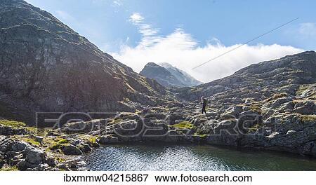 Wanderer an einem Bergsee, Rauhenbergsee im Klafferkessel, Seenplatte, Rohrmoos-Untertal, Schladminger Tauern, Steiermark, Osterreich, Europa View Large Photo Image Stock Photo - Wanderer an einem Bergsee, Rauhenbergsee im Klafferkessel, Seenplatte, Rohrmoos-Untertal, Schladminger Tauern, Steiermark, Osterreich, Europa. Fotosearch