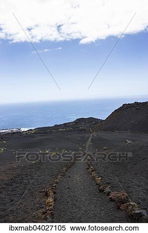 Stock Photography - Wanderweg durch Lavalandschaft, Monumento Natural de Los Volcanes de Teneguia Park, Sudkap Punta de Fuencaliente, La Palma, Kanarische Inseln, Spanien, Europa. Fotosearch