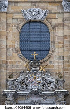 Stock Photograph - Wappen von Friedrich Carl von Schonborn uber dem Eingangsportal der Basilika Gossweinstein, 1739 geweiht, Architekt Baltasar Neumann, Gossweinstein, Oberfranken, Bayern, Deutschland, Europa. Fotosearch