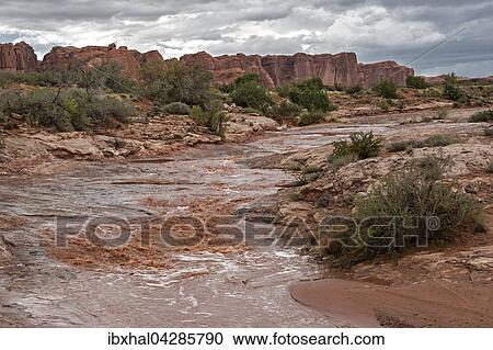 Wasserlauf nach einem straken Gewitter, Gewitterstimmung, hinten The Great Wall, Arches National Park, bei Moab, Utah, USA, Nordamerika View Large Photo Image Stock Image - Wasserlauf nach einem straken Gewitter, Gewitterstimmung, hinten The Great Wall, Arches National Park, bei Moab, Utah, USA, Nordamerika. Fotosearch
