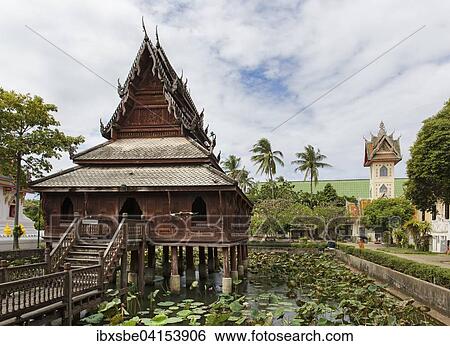 Wat Thung Si Mueang, Klosterbibliothek, Holz-Tempel, Lotusteich, Muang, Ubon Ratchathani, Isan, Isaan, Thailand, Asien View Large Photo Image Stock Photograph - Wat Thung Si Mueang, Klosterbibliothek, Holz-Tempel, Lotusteich, Muang, Ubon Ratchathani, Isan, Isaan, Thailand, Asien. Fotosearch