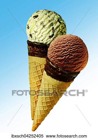 Stock Photography - Zwei Eistuten mit Eiskugeln, Schokolade und Pistazie. Fotosearch
