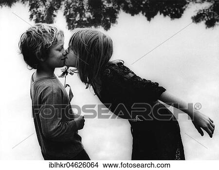 2 children kissing about 1970s, exact place unknown, Czech Republic, Europe View Large Photo Image Picture - 2 children kissing about 1970s, exact place unknown, Czech Republic, Europe. Fotosearch