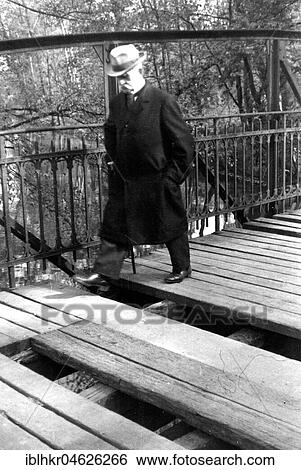 A man with walking stick and hat crosses a broken bridge, ca. 1955, Leipzig, Germany, Europe View Large Photo Image Stock Photograph - A man with walking stick and hat crosses a broken bridge, ca. 1955, Leipzig, Germany, Europe. Fotosearch