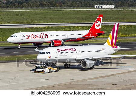 Air Berlin Airbus A321 and German Wings Airbus A320 on the runway, Dusseldorf International airport, Dusseldorf, North Rhine-Westphalia, Germany, Europe View Large Photo Image Stock Photo - Air Berlin Airbus A321 and German Wings Airbus A320 on the runway, Dusseldorf International airport, Dusseldorf, North Rhine-Westphalia, Germany, Europe. Fotosearch