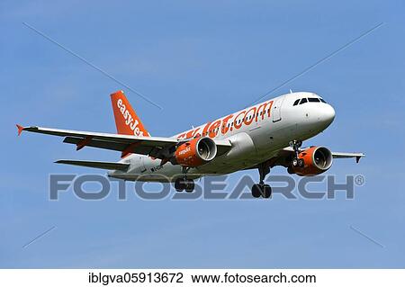 Airbus A319-100 of the airline easyJet on approach to Geneva, Switzerland, Europe View Large Photo Image Stock Image - Airbus A319-100 of the airline easyJet on approach to Geneva, Switzerland, Europe. Fotosearch