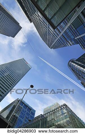 Airplane flying over skyscrapers, Canary Wharf, London, England, United Kingdom, Europe View Large Photo Image Stock Image - Airplane flying over skyscrapers, Canary Wharf, London, England, United Kingdom, Europe. Fotosearch