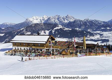 Stock Image - Alpengasthof Laerchfilz Hochalm in front of Buchensteinwand and Loferer Steinbergen, Ski area Saalbach Hinterglemm Leogang Fieberbrunn, Fieberbrunn, Tyrol, Austria, Europe. Fotosearch