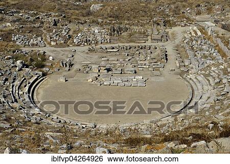 Amphitheater in the theater district of the island of Delos, UNESCO World Heritage Site, Cyclades, Greece, Europe View Large Photo Image Stock Photograph - Amphitheater in the theater district of the island of Delos, UNESCO World Heritage Site, Cyclades, Greece, Europe. Fotosearch
