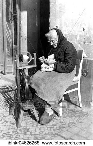 An old woman weaves on the street, ca. 1955, Leipzig, Germany, Europe View Large Photo Image Stock Photo - An old woman weaves on the street, ca. 1955, Leipzig, Germany, Europe. Fotosearch
