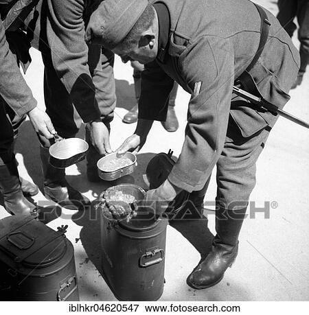 Approx. 1939, 1941, training Wehrmacht, original caption: Essensausgabe in Nordrach, Germany, Europe View Large Photo Image Stock Photo - Approx. 1939, 1941, training Wehrmacht, original caption: Essensausgabe in Nordrach, Germany, Europe. Fotosearch