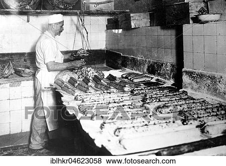 Baker bakes Dresden Christstollen ca. 1930, Dresden, Germany, Europe View Large Photo Image Stock Photo - Baker bakes Dresden Christstollen ca. 1930, Dresden, Germany, Europe. Fotosearch