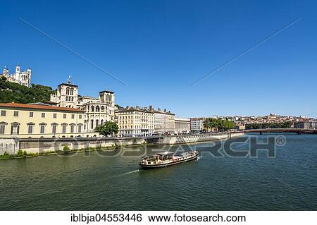 Barge on the Saone river past the cathedral Saint Jean, Lyon, Auvergne Rhone Alpes, France, Europe View Large Photo Image Stock Photograph - Barge on the Saone river past the cathedral Saint Jean, Lyon, Auvergne Rhone Alpes, France, Europe. Fotosearch