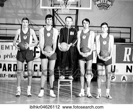Stock Image - Basketball player with tiny trainer ca. 1970s, exact place unknown, Czech Republic, Europe. Fotosearch