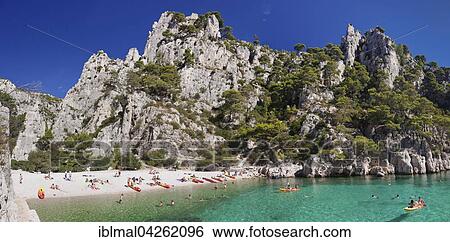 Stock Photograph - Bathers, Les Calanques d'en Vau, Calanques National Park or Parc National des Calanques, Cassis, Provence, Provence-Alpes-Cote d'Azur, Southern France, France, Europe. Fotosearch