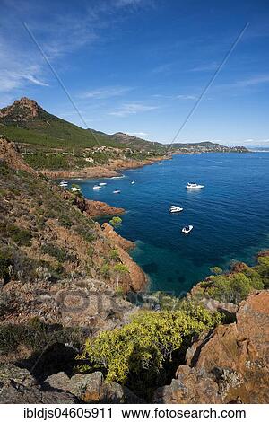 Stock Image - Bay with pleasure boats, Massif de l' Esterel, Esterel Mountains, Département Var, Region Provence-Alpes-Côte d' Azur, France, Europe. Fotosearch