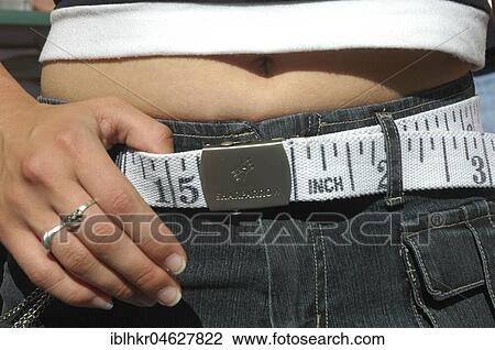 Belts as tape measure for belly circumference, Germany, Europe View Large Photo Image Stock Image - Belts as tape measure for belly circumference, Germany, Europe. Fotosearch