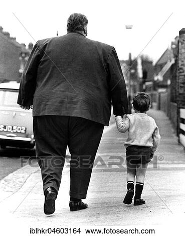 Big man and little boy, England, Great Britain View Large Photo Image Picture - Big man and little boy, England, Great Britain. Fotosearch