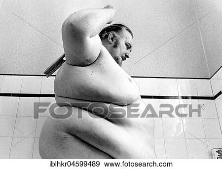 Big man washes himself, England, Great Britain View Large Photo Image Stock Photo - Big man washes himself, England, Great Britain. Fotosearch