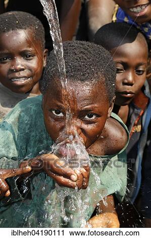 Boy drinking water, Matamba-Solo, Bandundu Province, Congo-Brazzaville, Africa View Large Photo Image Stock Image - Boy drinking water, Matamba-Solo, Bandundu Province, Congo-Brazzaville, Africa. Fotosearch