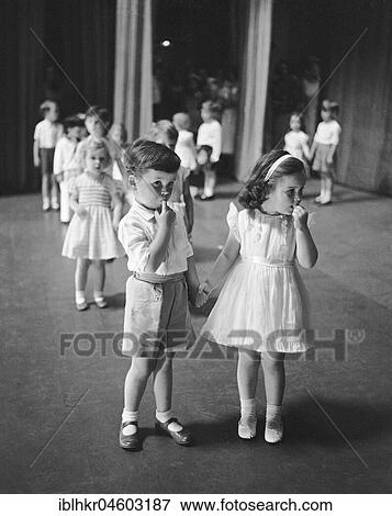 Boy shy with a girl, line up to dance, England, Great Britain View Large Photo Image Stock Photo - Boy shy with a girl, line up to dance, England, Great Britain. Fotosearch