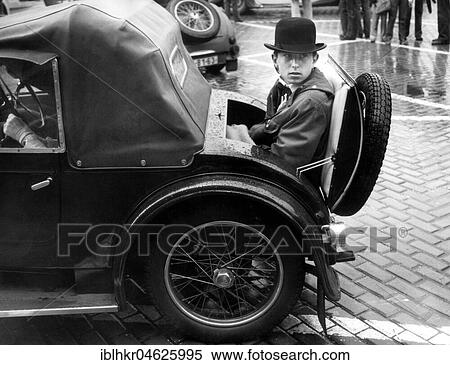 Boy sits in the boot of a vintage car from the 1970s, exact place unknown, Czech Republic, Europe View Large Photo Image Stock Photography - Boy sits in the boot of a vintage car from the 1970s, exact place unknown, Czech Republic, Europe. Fotosearch