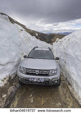 Car driving to the hot spring area Hveradalir through snow, Kerlingarfjöll, Suðurland, Iceland, Europe View Large Photo Image Stock Photo - Car driving to the hot spring area Hveradalir through snow, Kerlingarfjöll, Suðurland, Iceland, Europe. Fotosearch