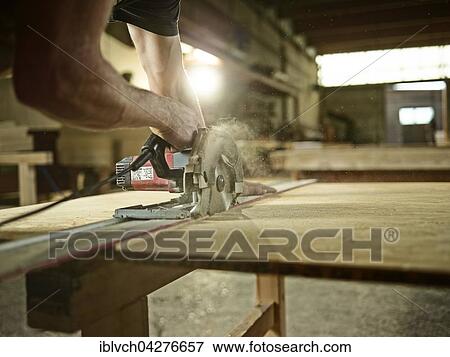 Carpenter cutting chipboard with a circular saw, Austria, Europe View Large Photo Image Stock Photo - Carpenter cutting chipboard with a circular saw, Austria, Europe. Fotosearch