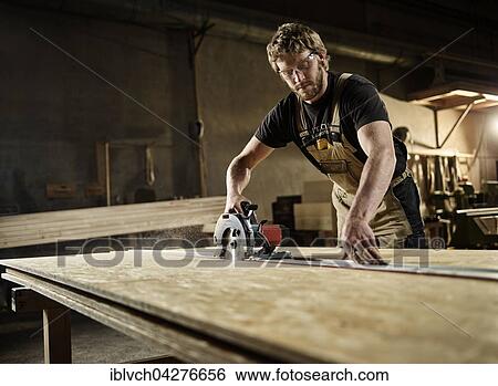 Carpenter cutting chipboard with a circular saw, Austria, Europe View Large Photo Image Stock Photograph - Carpenter cutting chipboard with a circular saw, Austria, Europe. Fotosearch