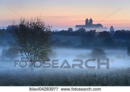 Castle hill with collegiate church of St. Servatius at sunrise, fog, UNESCO, in Quedlinburg, Saxony-Anhalt, Germany, Europe View Large Photo Image Stock Photo - Castle hill with collegiate church of St. Servatius at sunrise, fog, UNESCO, in Quedlinburg, Saxony-Anhalt, Germany, Europe. Fotosearch