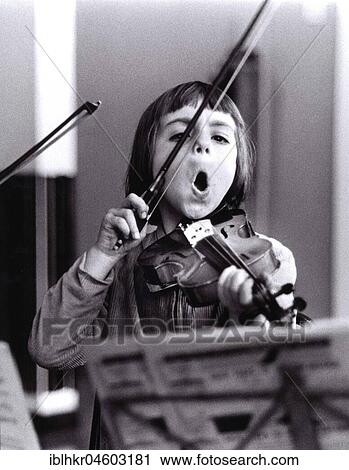 Child plays violin and sings, England, Great Britain View Large Photo Image Stock Image - Child plays violin and sings, England, Great Britain. Fotosearch