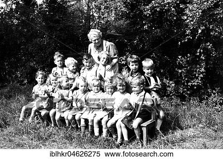 Children can be photographed in the green with the kindergarten teacher, ca. 1955, Leipzig, Germany, Europe View Large Photo Image Stock Photography - Children can be photographed in the green with the kindergarten teacher, ca. 1955, Leipzig, Germany, Europe. Fotosearch