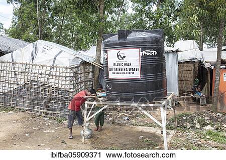 Children fetch water from a tank, camp for Rohingya refugees from Myanmar, Kutupalong, Cox Bazar, Bangladesh, Asia View Large Photo Image Stock Image - Children fetch water from a tank, camp for Rohingya refugees from Myanmar, Kutupalong, Cox Bazar, Bangladesh, Asia. Fotosearch