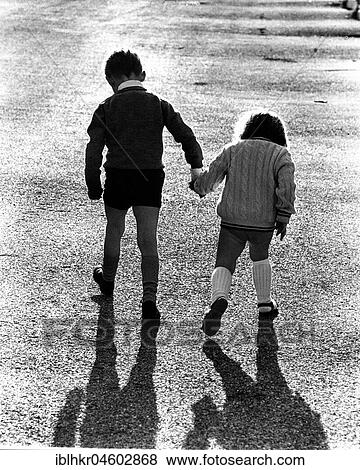 Children run hand in hand, England, Great Britain View Large Photo Image Stock Photo - Children run hand in hand, England, Great Britain. Fotosearch
