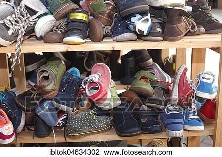 Children's shoes in a shelf, Germany, Europe View Large Photo Image Stock Image - Children's shoes in a shelf, Germany, Europe. Fotosearch