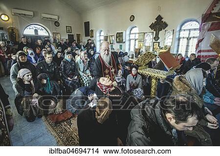Picture - Church of Father Sergei during an exorcism, he is widely known as an exorcist and receives people seeking help from all over Russia, Ochamchira, Abkhazia, Georgia, Asia. Fotosearch