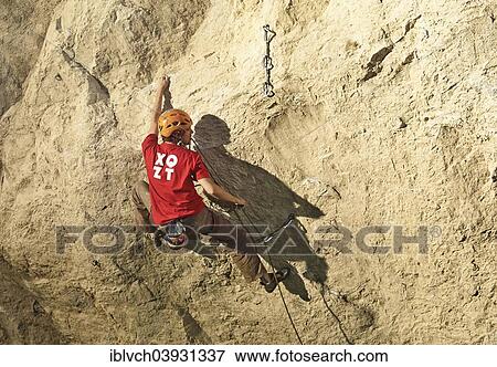 Stock Photo - Climber lead climbing on a rock face, Martinswand, Zirl, Tyrol, Austria, Europe. Fotosearch