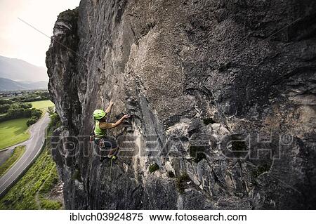 Stock Photography - Climber lead climbing on a rock face, Martinswand, Zirl, Tyrol, Austria, Europe. Fotosearch