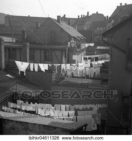Stock Photograph - Clothes lines stretched between houses, ca. 1955, Freiburg, Germany, Europe. Fotosearch