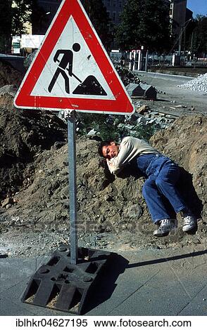 Stock Photography - Construction worker sleeps at construction site, Berlin, Germany, Europe. Fotosearch