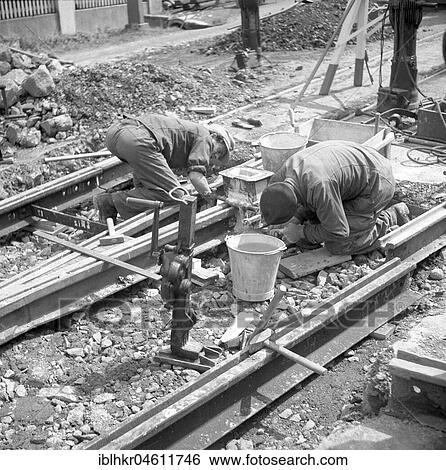 Construction workers laying tracks, around 1950, Freiburg, Germany, Europe View Large Photo Image Stock Photograph - Construction workers laying tracks, around 1950, Freiburg, Germany, Europe. Fotosearch