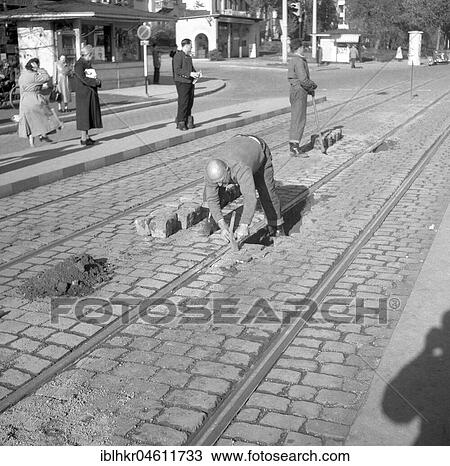 Construction workers paving a road around 1950, Freiburg, Germany, Europe View Large Photo Image Stock Image - Construction workers paving a road around 1950, Freiburg, Germany, Europe. Fotosearch
